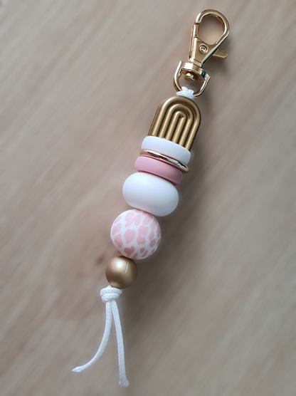 Blush pink cow print beaded keyring with with white gold and pink tones