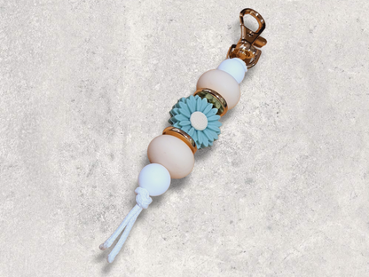 green and beige daisy flower silicone bead with beige gold and white  tones keyring
